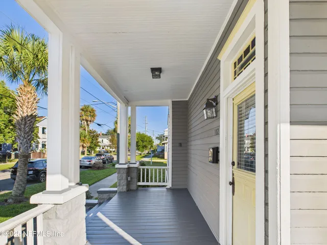 a view of front door deck and patio