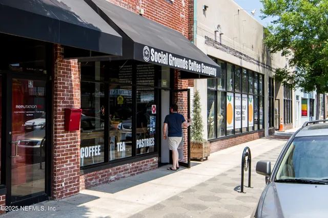 an aerial view of a house with swimming pool patio and outdoor seating