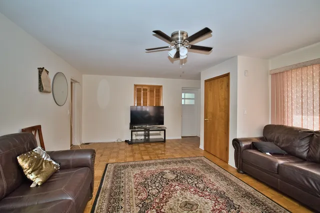 a living room with furniture and a rug