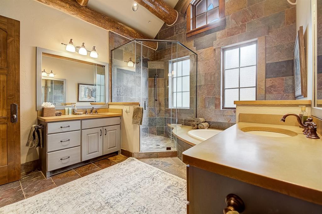 350 Timbertrail Road Breckenridge, CO 80424 - Photo 15 of 35 a spacious bathroom with a sink double vanity and a mirror