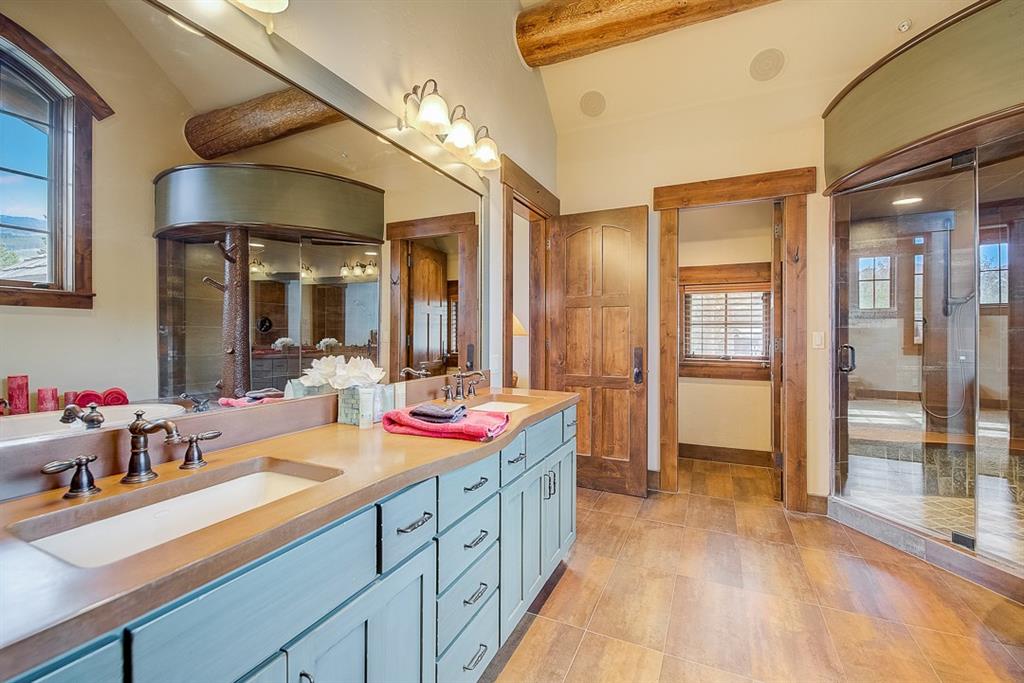 350 Timbertrail Road Breckenridge, CO 80424 - Photo 20 of 35 a spacious bathroom with a sink double vanity and shower