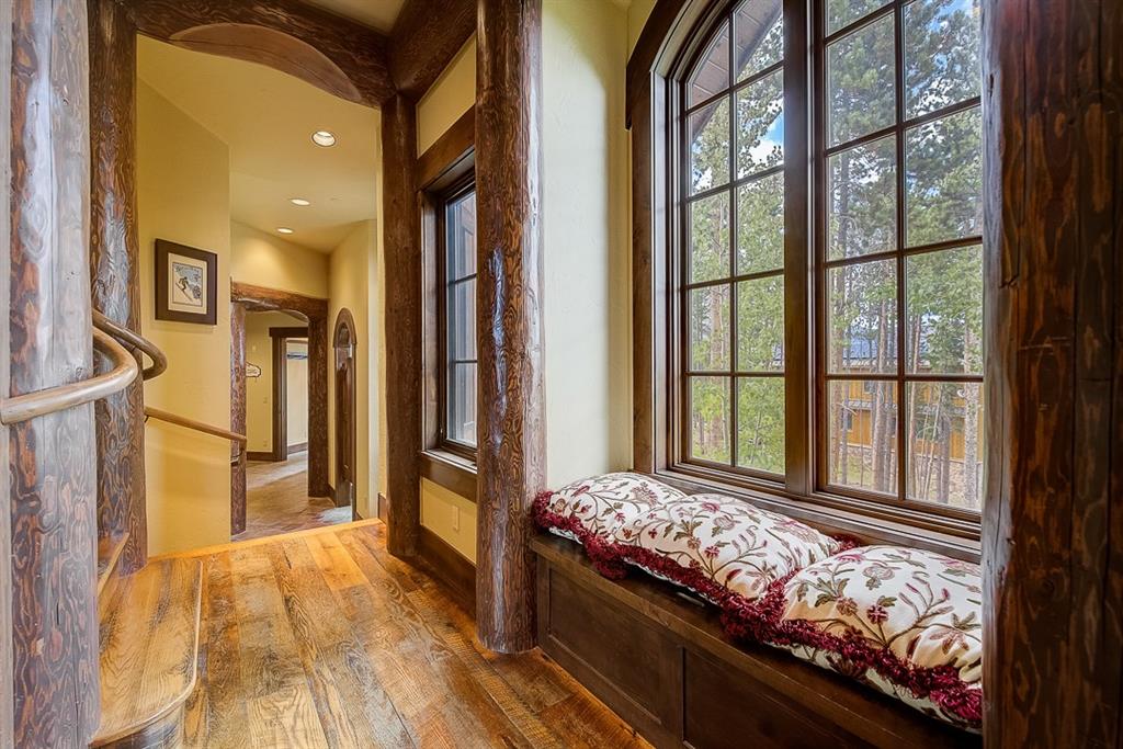 350 Timbertrail Road Breckenridge, CO 80424 - Photo 22 of 35 a bedroom with large window and a bed