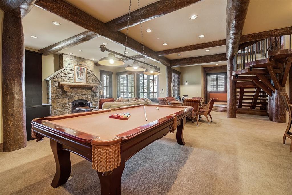 350 Timbertrail Road Breckenridge, CO 80424 - Photo 23 of 35 a room with furniture a clock and a fireplace