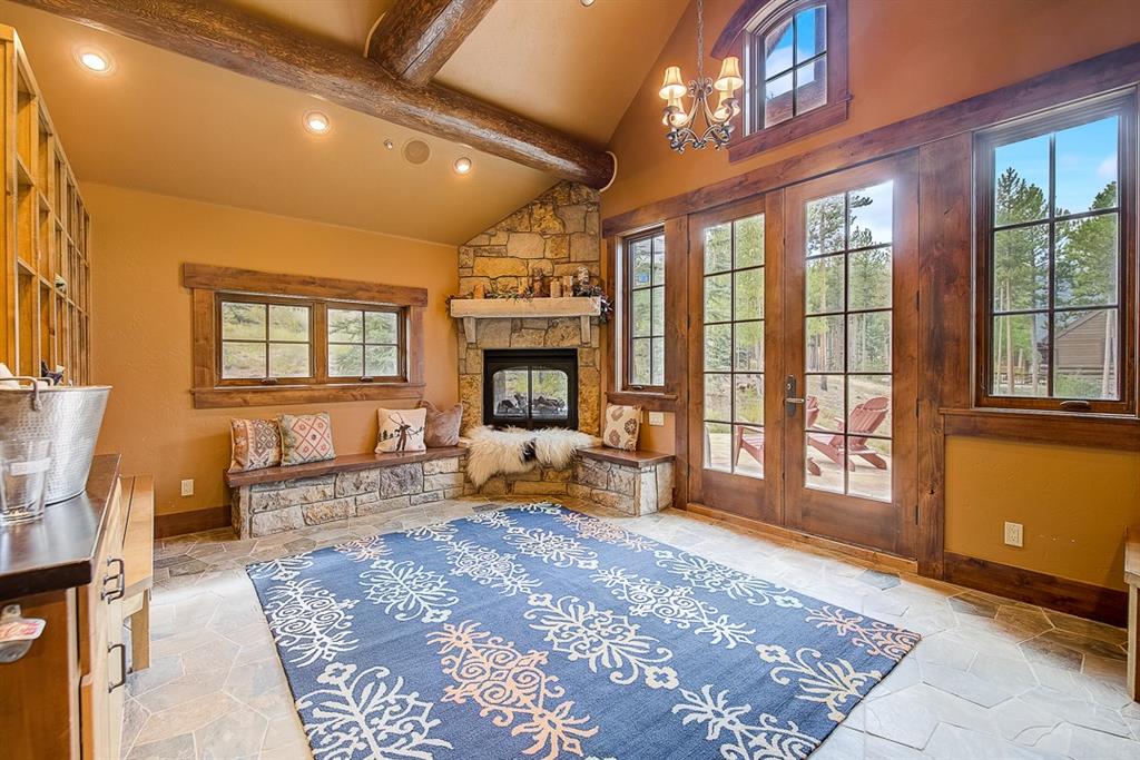350 Timbertrail Road Breckenridge, CO 80424 - Photo 32 of 35 a living room with furniture large window and a fireplace
