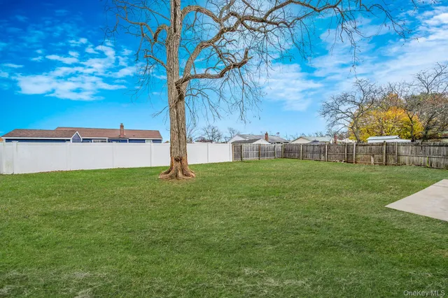 a view of yard with swimming pool and green space