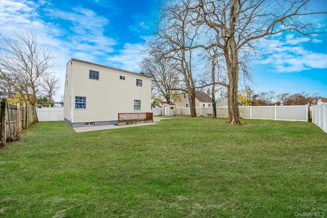 a view of a backyard with large trees