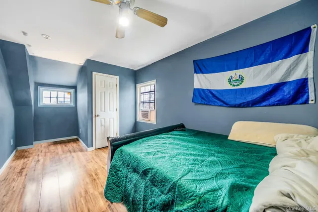 a bed room with a bed and a window