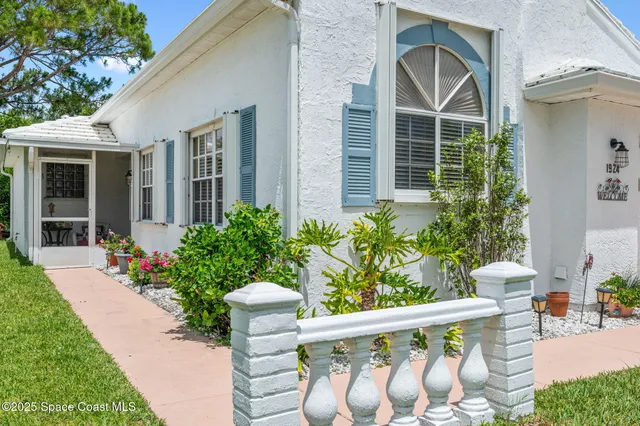 a front view of a house having yard and seating space