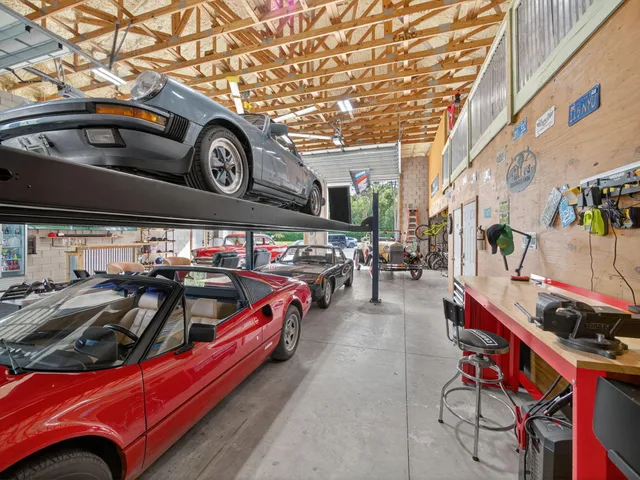 a view of parking garage with cars parked