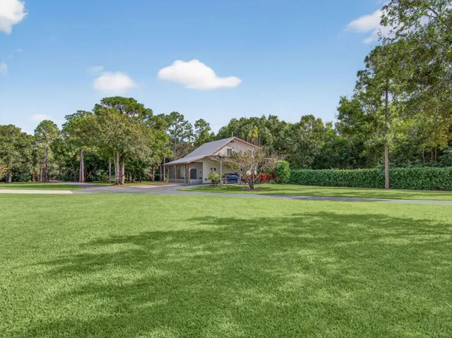 a view of a house with a big yard