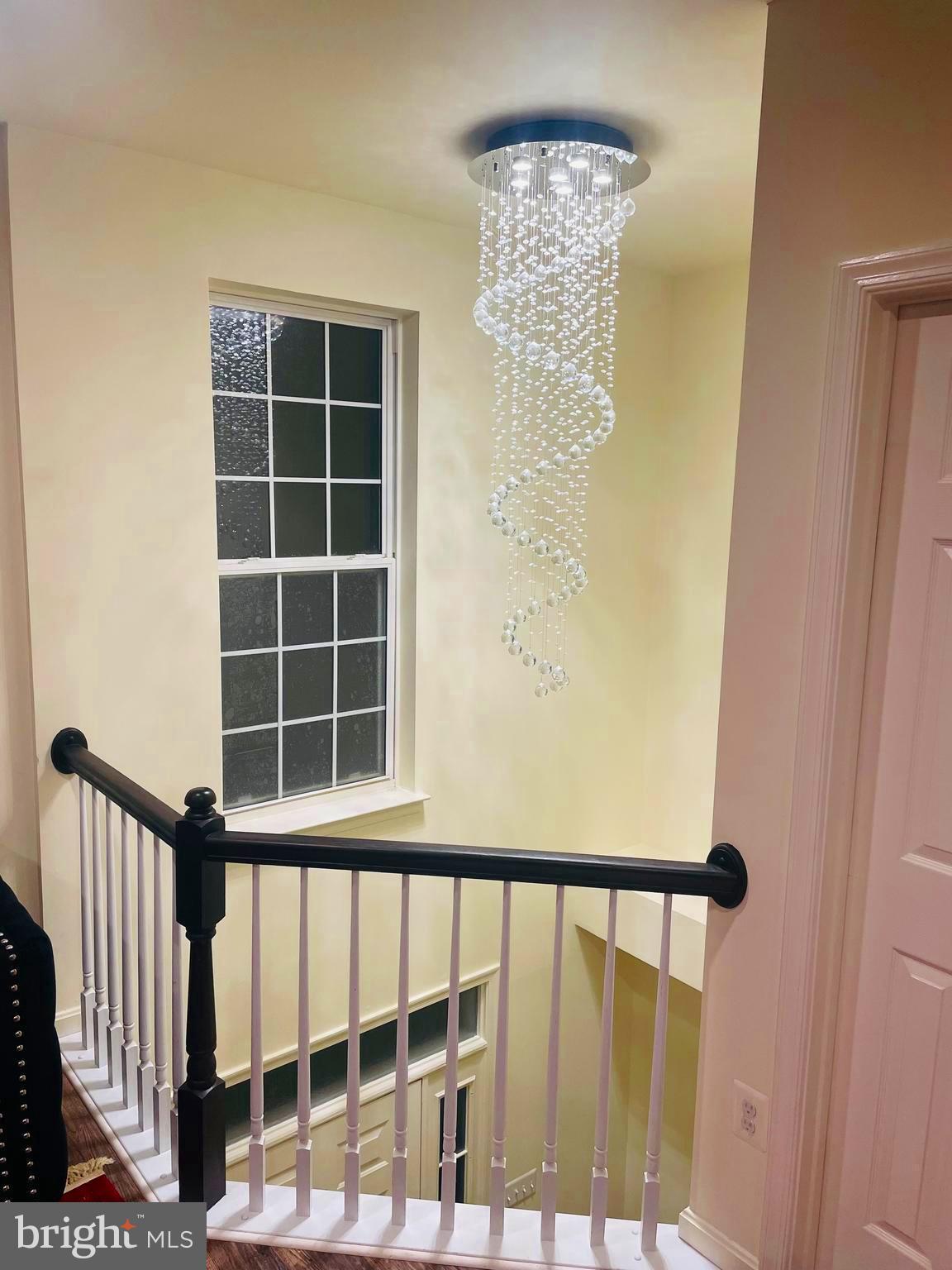 43005 Beachall Street Chantilly, VA 20152 - Photo 13 of 28 a view of staircase with railing and a window