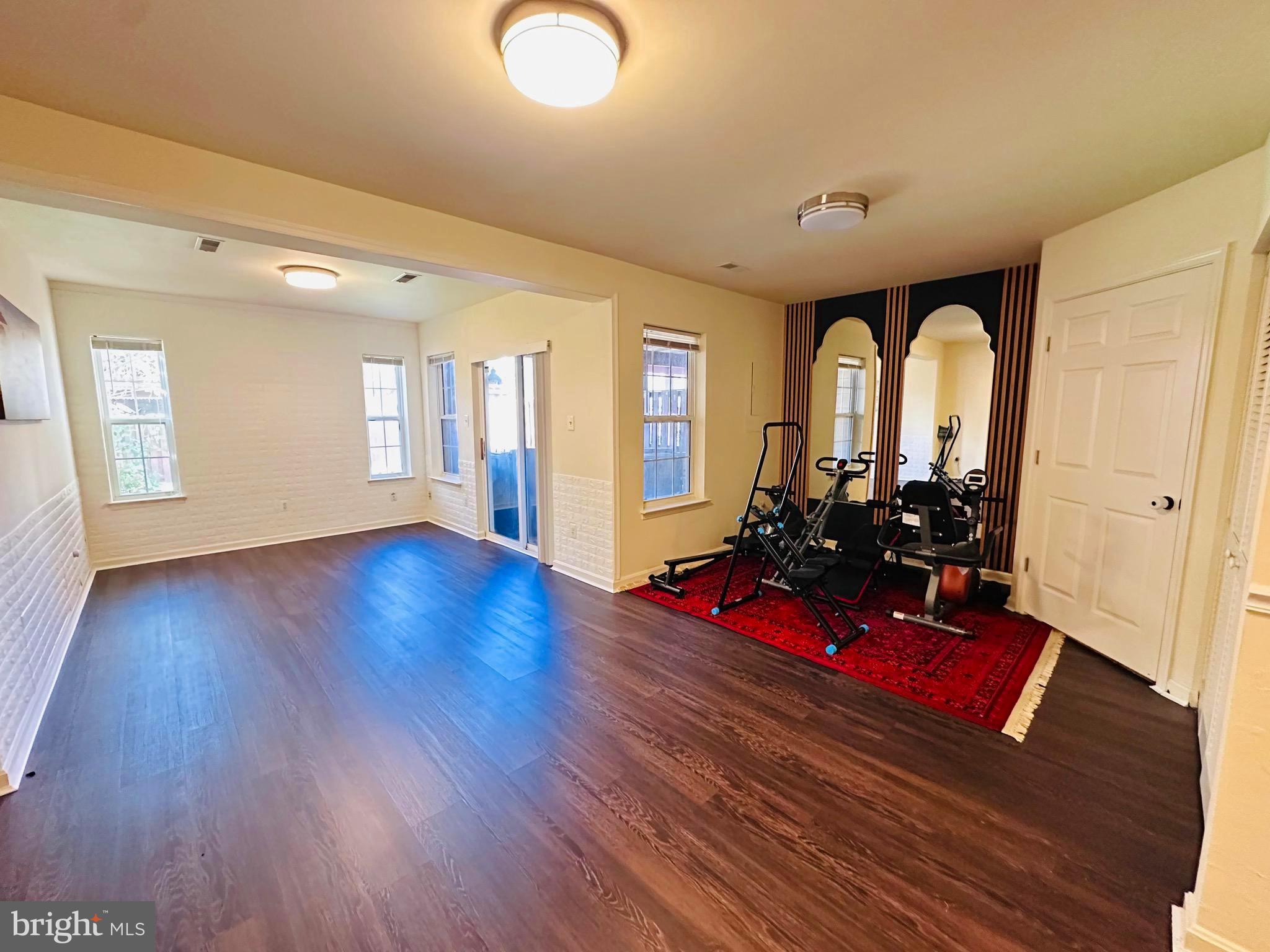 43005 Beachall Street Chantilly, VA 20152 - Photo 16 of 28 a view of a living room with hardwood floor and a living room