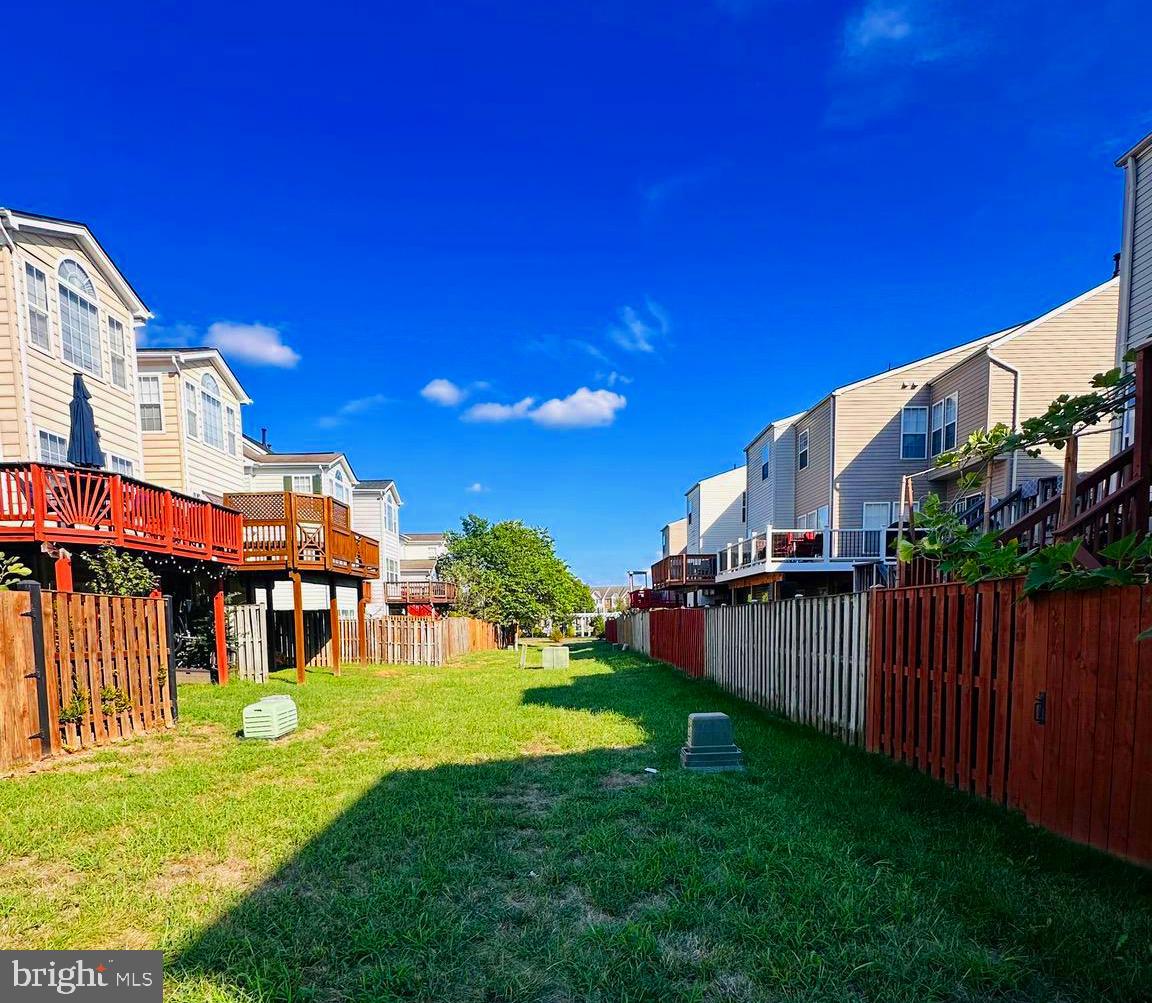 43005 Beachall Street Chantilly, VA 20152 - Photo 27 of 28 a view of a house with a yard