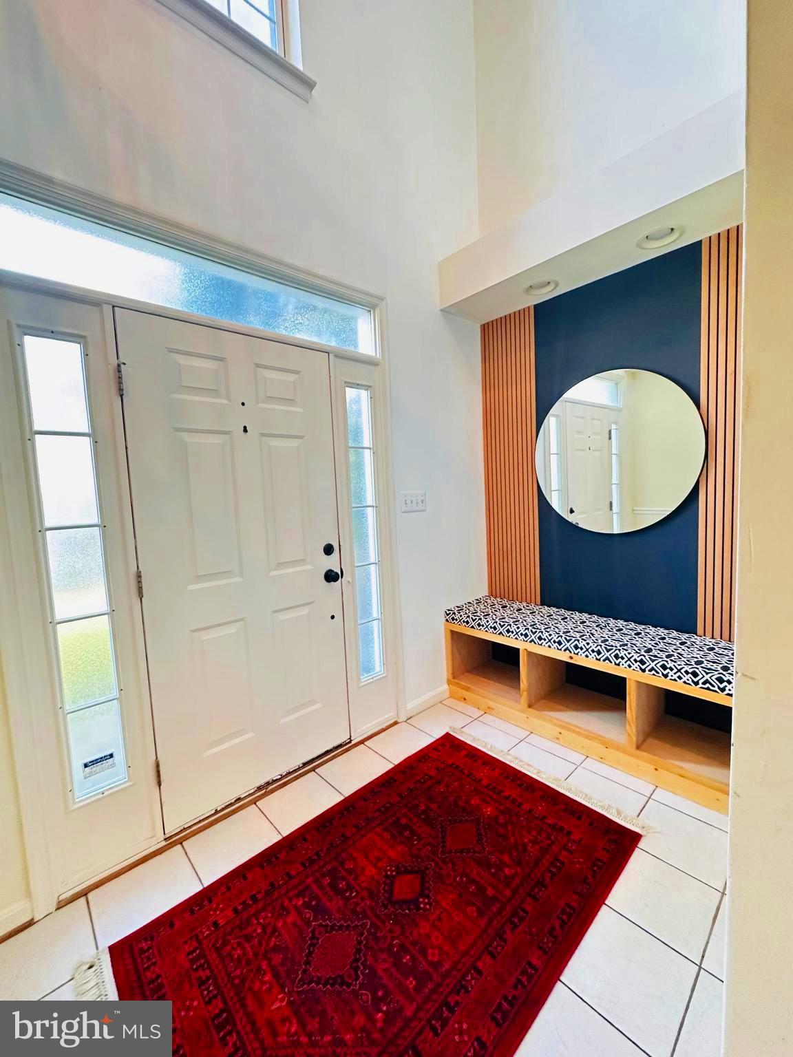 43005 Beachall Street Chantilly, VA 20152 - Photo 3 of 28 a bedroom with a bed and a mirror