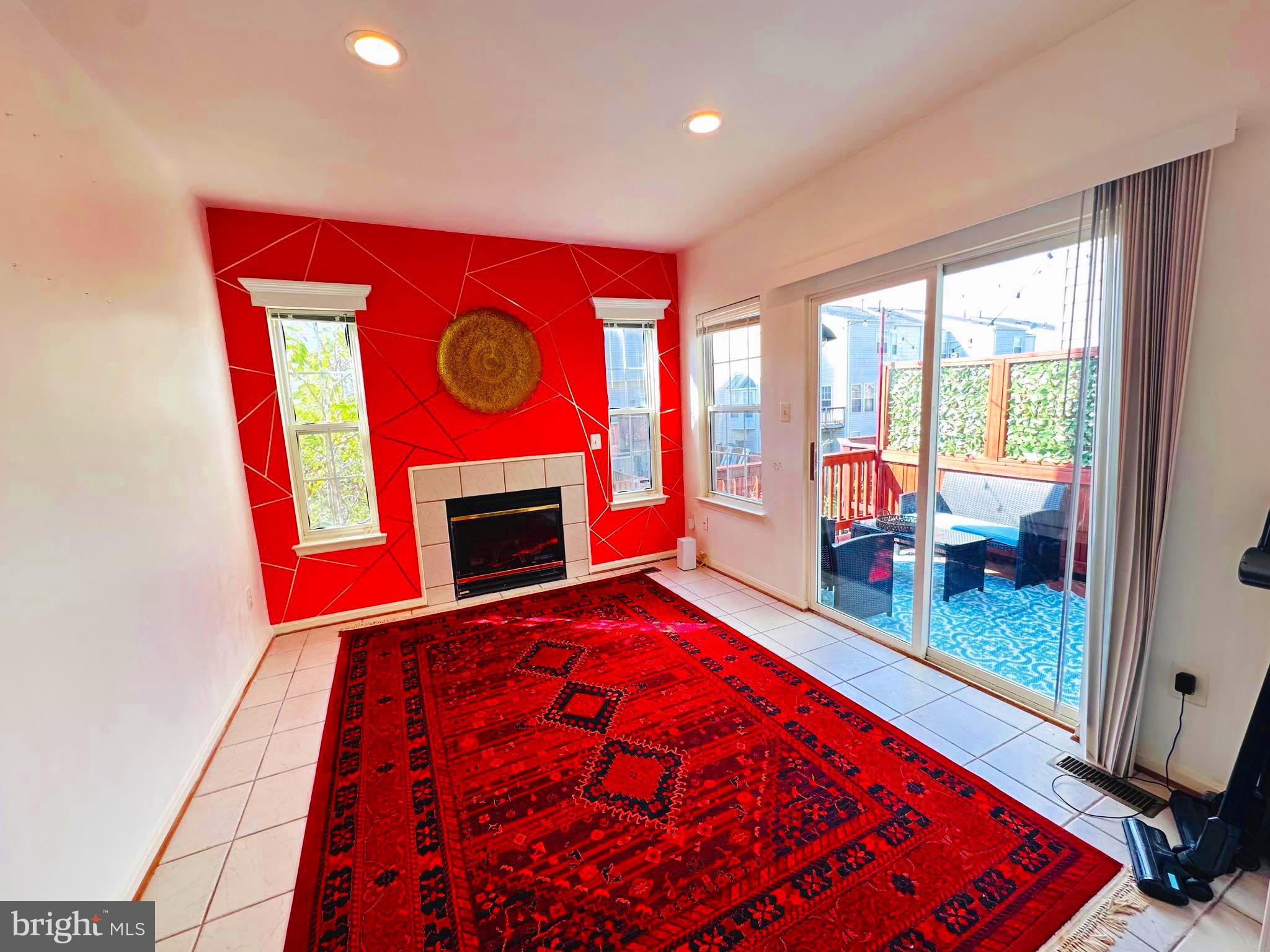 43005 Beachall Street Chantilly, VA 20152 - Photo 5 of 28 a view of an empty room with a fireplace and a window