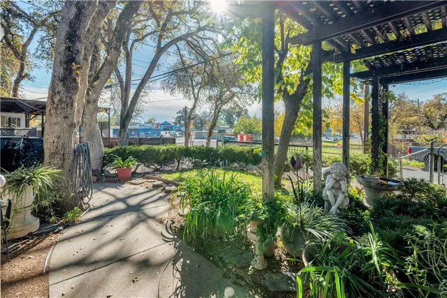 a view of backyard with swimming pool and outdoor seating