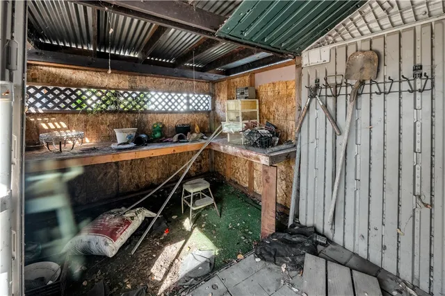 a view of an empty room with wooden roof