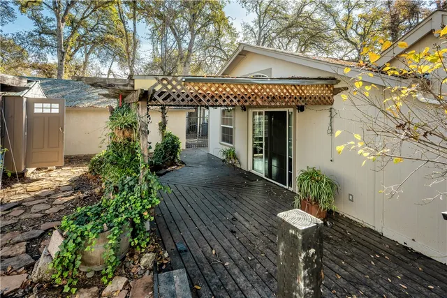front view of a house with potted plants