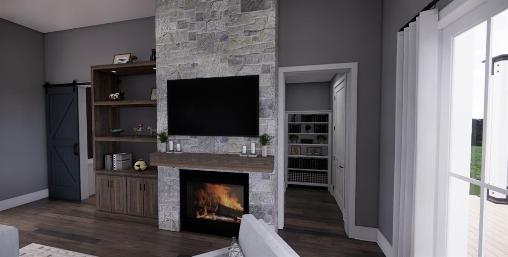 Tbd Tbd Tbd Spring Dripping Springs, TX 78620 - Photo 9 of 27 a living room with a fireplace and a flat screen tv