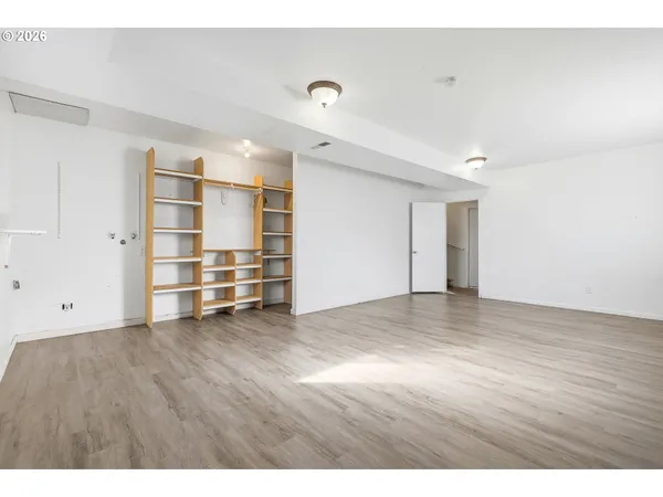 a view of an empty room with a closet