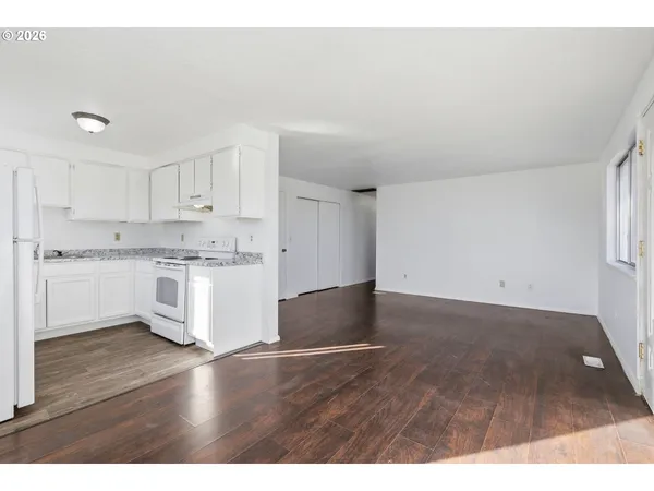 a view of kitchen with wooden floor