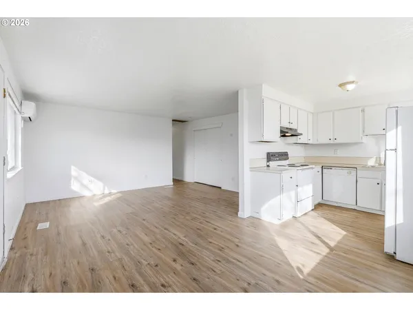 a view of kitchen with wooden floor