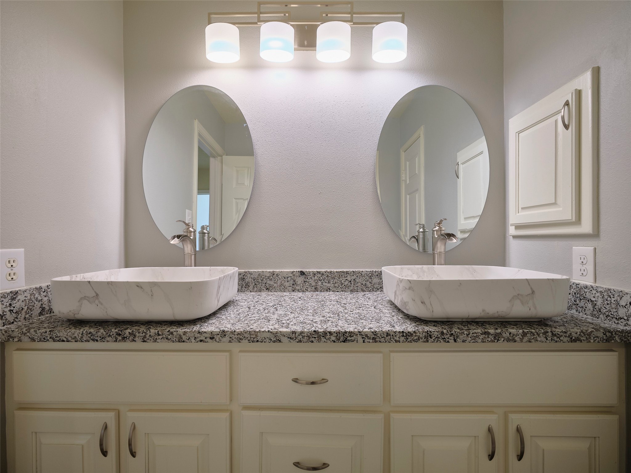 7626 Painton Lane Spring, TX 77389 - Photo 15 of 19 THE ADDITIONAL BEDROOMS ARE NEAR THE SECONDARY FULL BATH WITH MODERN SINKS, TUB AND SHOWER