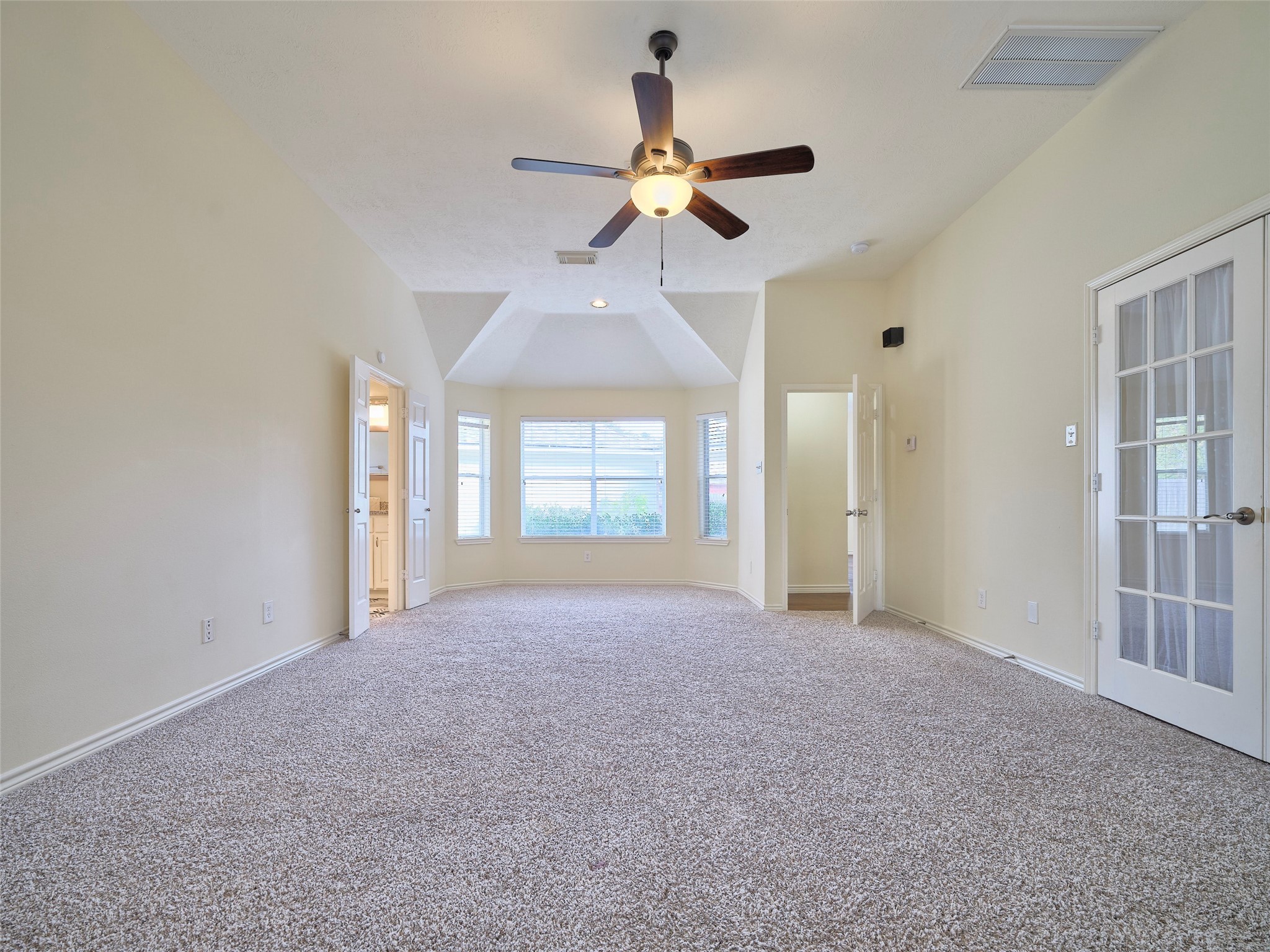 7626 Painton Lane Spring, TX 77389 - Photo 7 of 19 THE PRIMARY BEDROOM WITH FRENCH DOORS AND A PRIVATE STUDY/GYM AREA