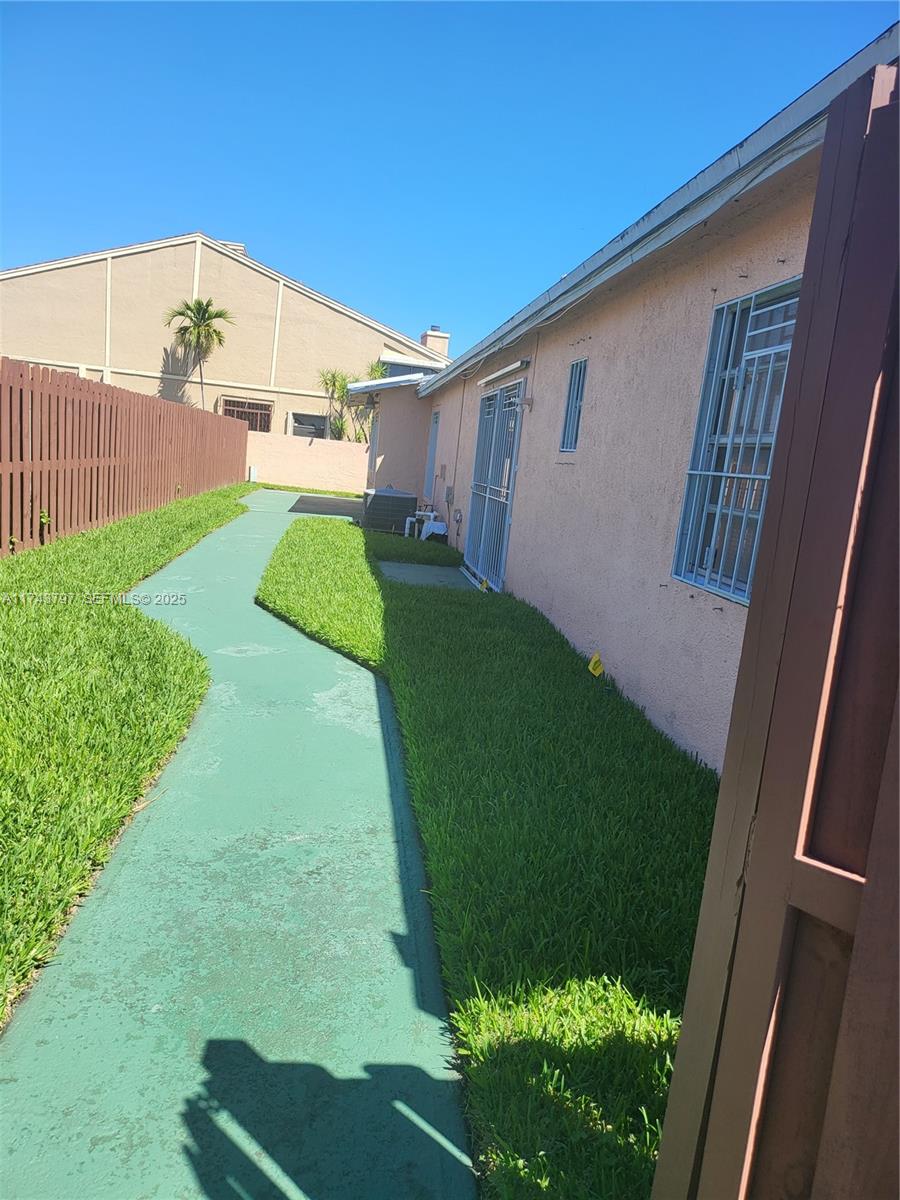 6771 Northwest 199th Terrace Hialeah, FL 33015 - Photo 2 of 42 a view of a backyard with plants and a patio