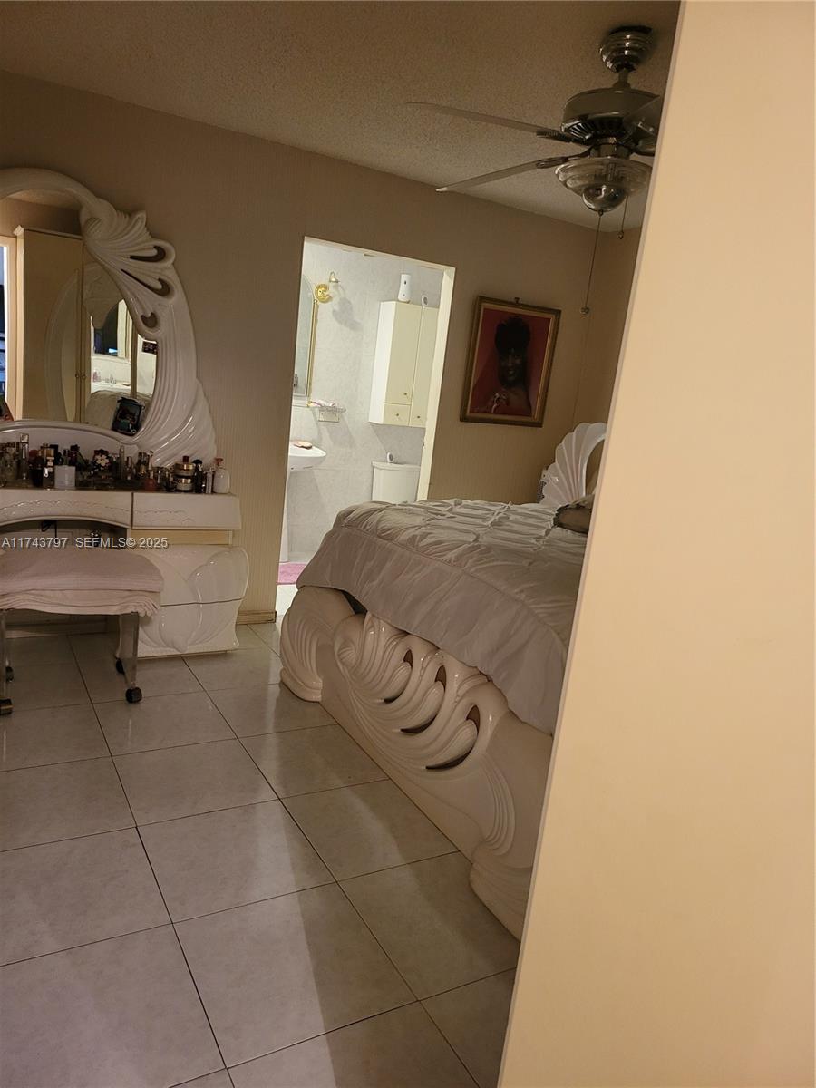6771 Northwest 199th Terrace Hialeah, FL 33015 - Photo 25 of 42 a bathroom with a sink and a mirror