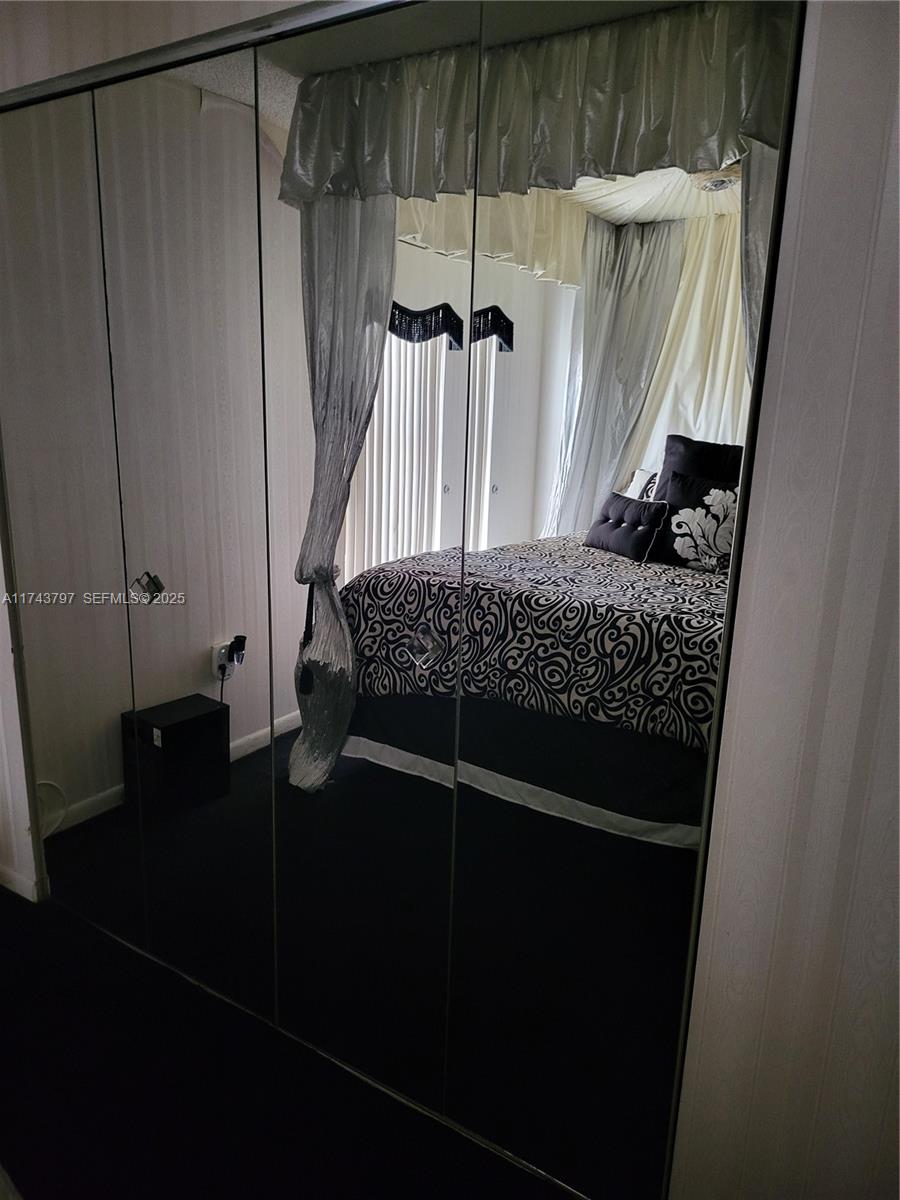 6771 Northwest 199th Terrace Hialeah, FL 33015 - Photo 28 of 42 a close view of walk in closet