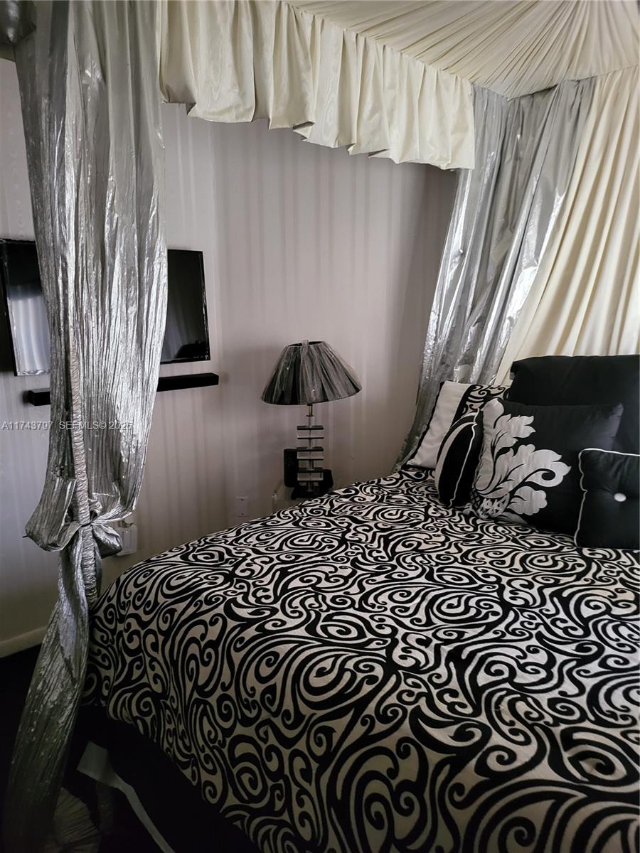 6771 Northwest 199th Terrace Hialeah, FL 33015 - Photo 29 of 42 a close view of a sink a bed and a window