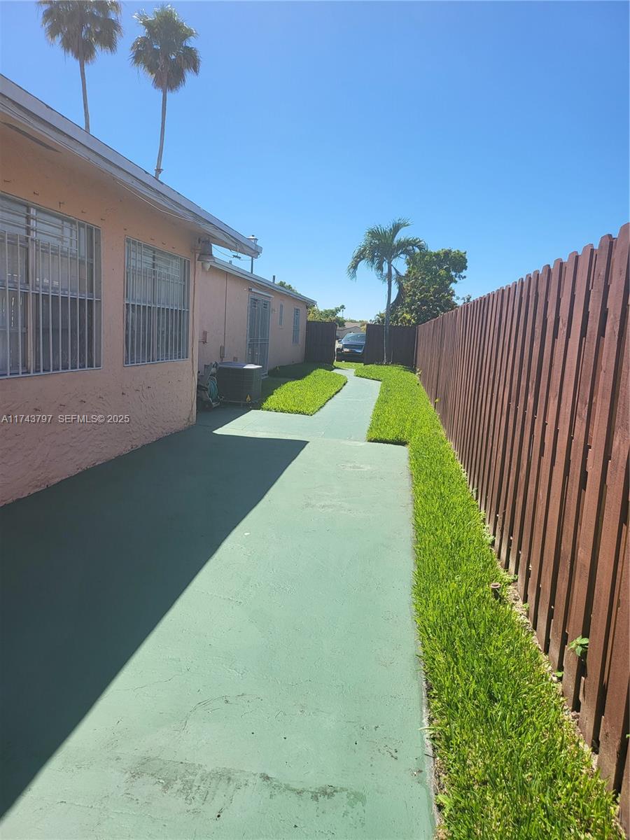 6771 Northwest 199th Terrace Hialeah, FL 33015 - Photo 3 of 42 a view of swimming pool with a backyard