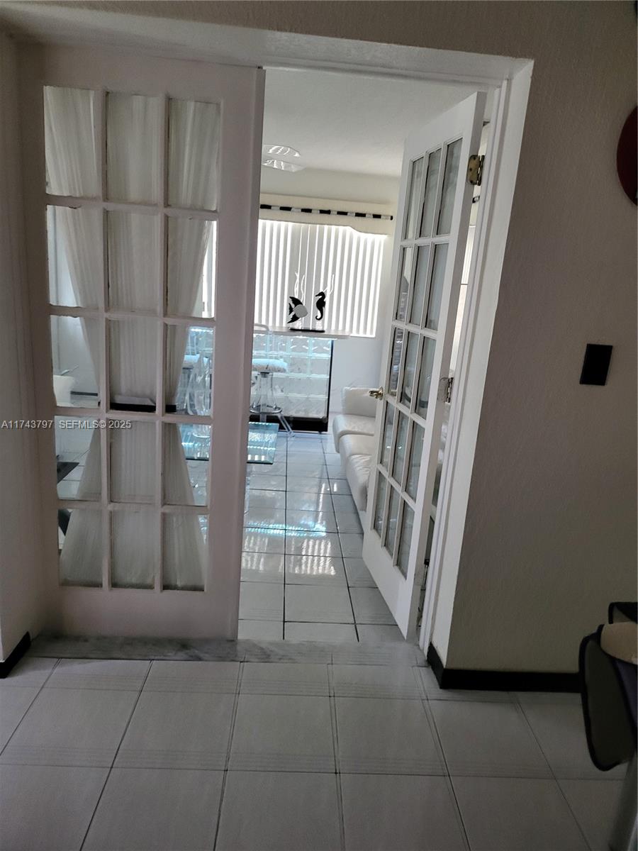 6771 Northwest 199th Terrace Hialeah, FL 33015 - Photo 35 of 42 a view of a hallway with staircase