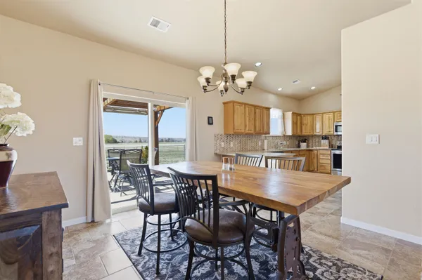 a view of a dining room and livingroom with furniture