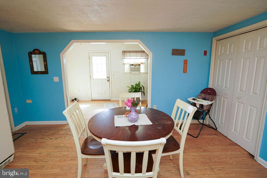 212 Main Street Preston, MD 21655 - Photo 14 of 56 a dining room with furniture and wooden floor