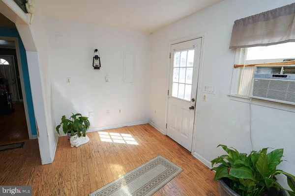 a view of entryway with wooden floor