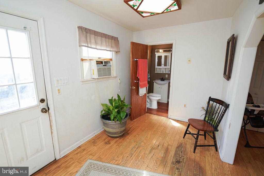 212 Main Street Preston, MD 21655 - Photo 15 of 40 a room with furniture and wooden floor