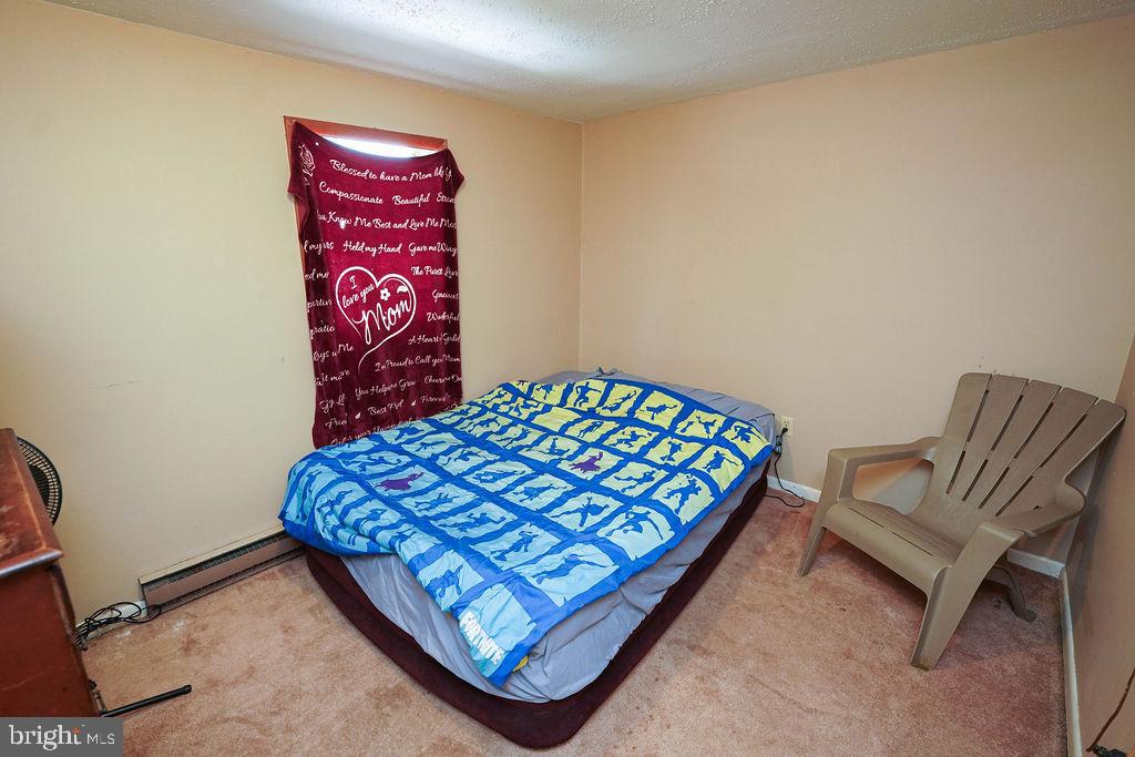 212 Main Street Preston, MD 21655 - Photo 40 of 40 a bedroom with a bed and a couch