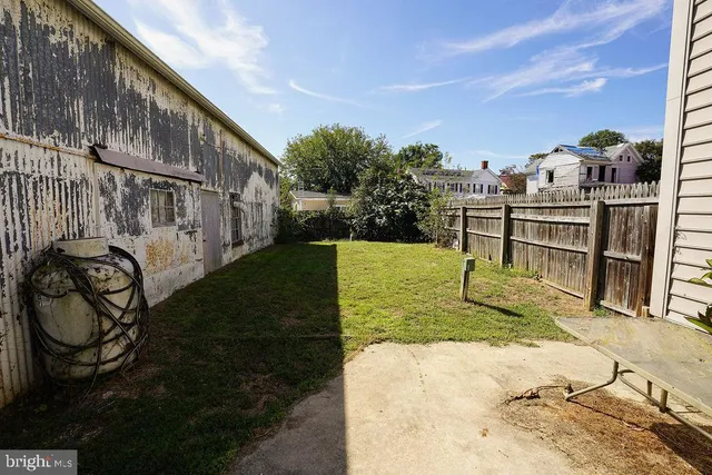 a view of an entryway with wooden floor and a front door