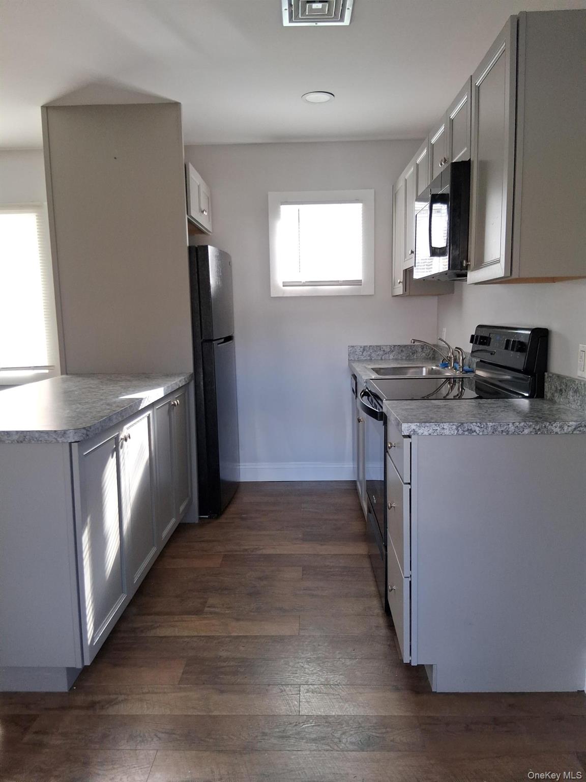 218 Highway 199 Red Hook, NY 12571 - Photo 3 of 7 a kitchen with stainless steel appliances granite countertop a stove a sink and a refrigerator