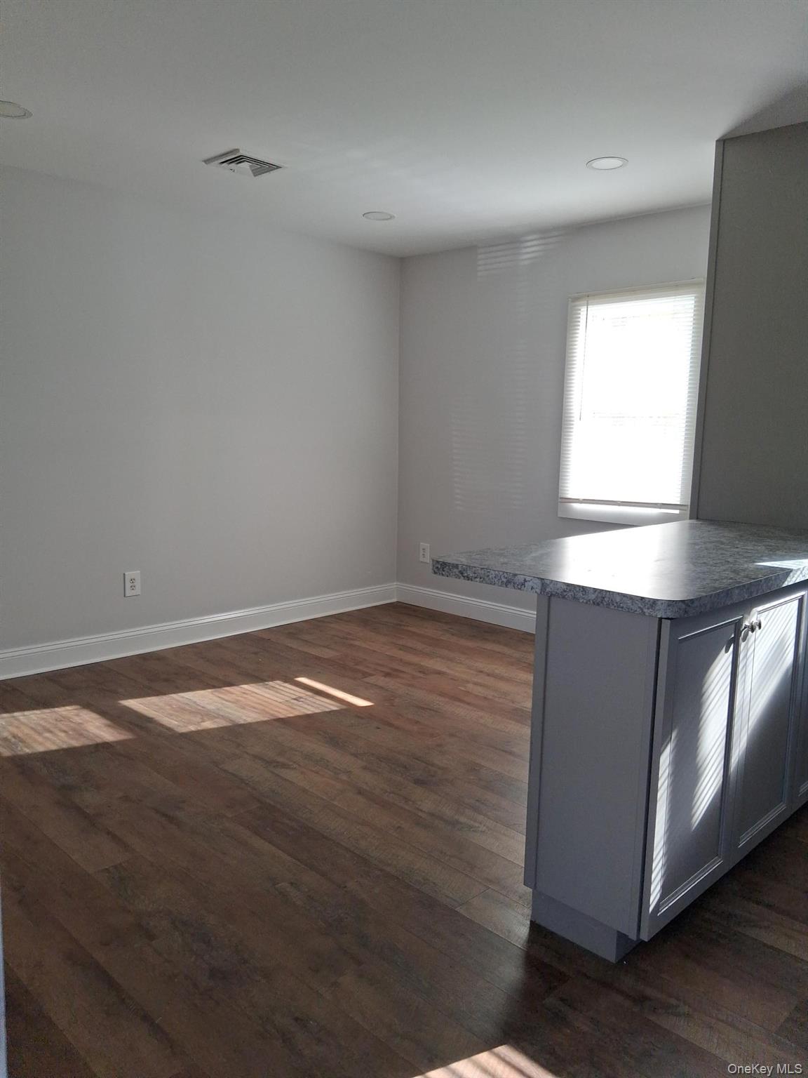 218 Highway 199 Red Hook, NY 12571 - Photo 4 of 7 a view of empty room with wooden floor and fan