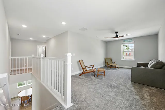 an aerial view of residential houses with outdoor space and swimming pool