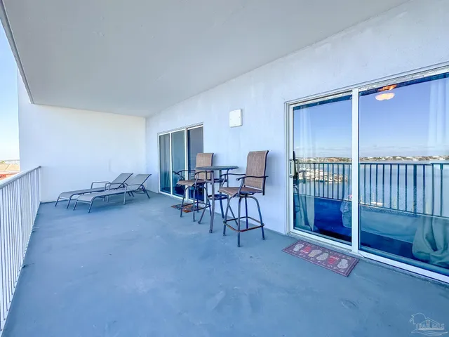 a kitchen with kitchen island granite countertop white cabinets and sink