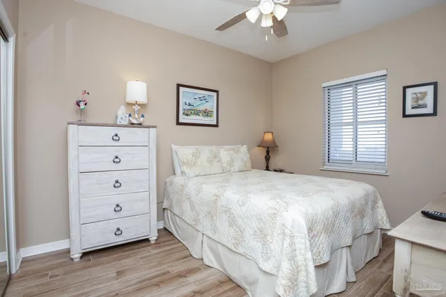 a bedroom with a bed and a lamp