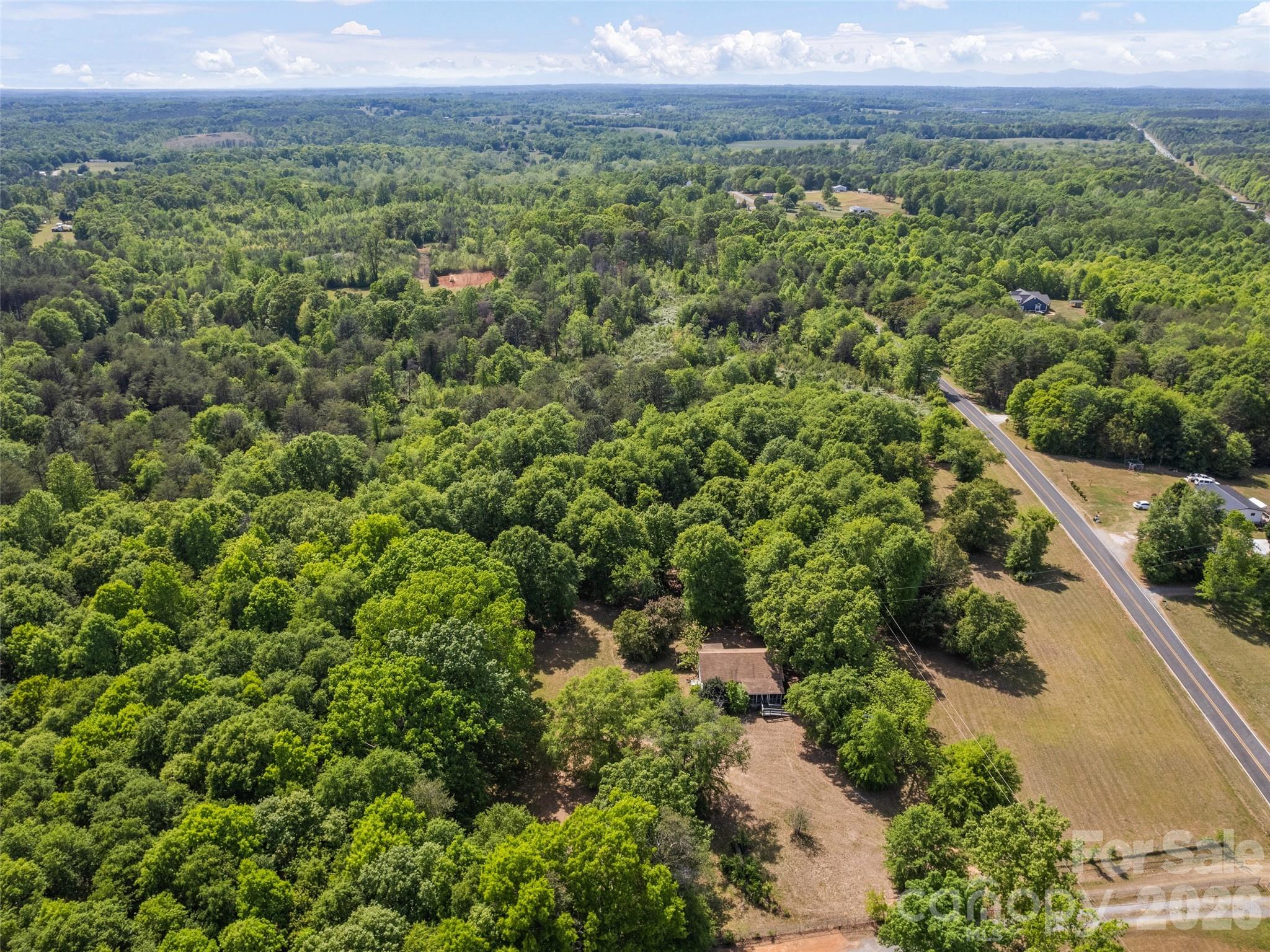 311 Soco Gap Road Ellenboro, NC 28040 - Photo 23 of 24 an aerial view of a house with a yard
