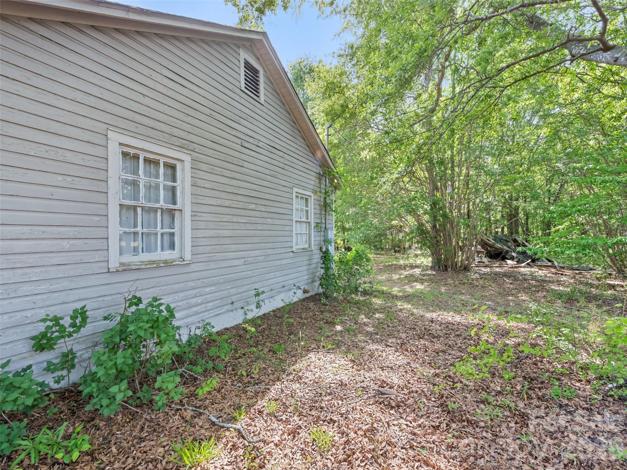 311 Soco Gap Road Ellenboro, NC 28040 - Photo 6 of 24 a view of a house with a yard