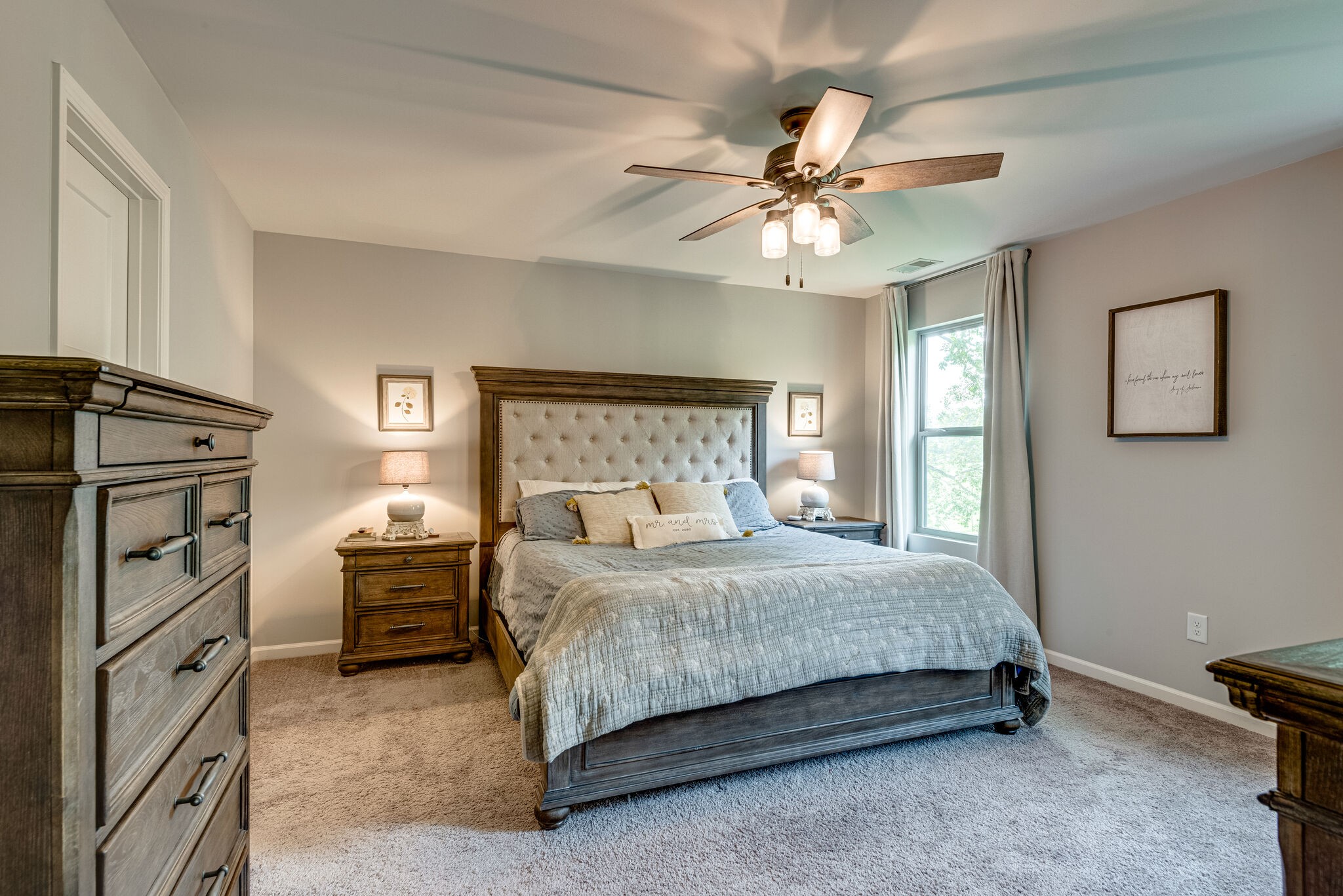 737 Walter Morris Road Lebanon, TN 37087 - Photo 19 of 30 a bedroom with a bed and a chandelier