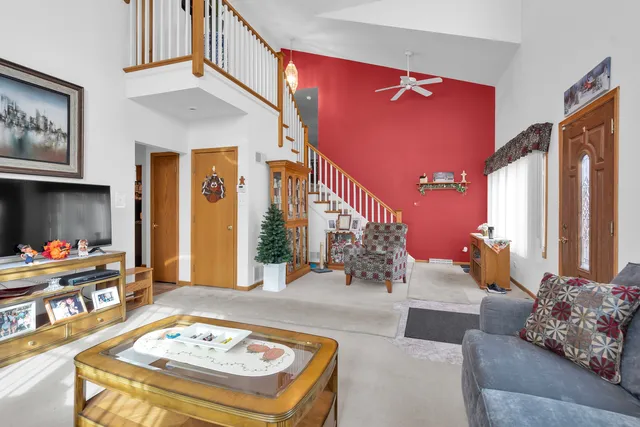 a living room with furniture and a table