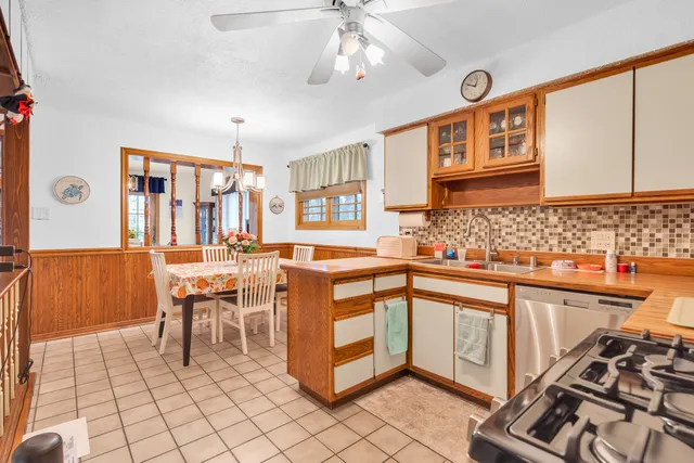 a kitchen with stainless steel appliances granite countertop a sink and cabinets